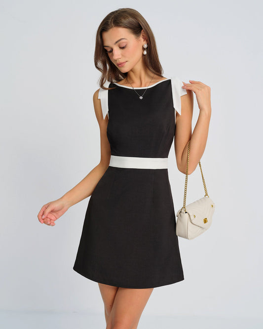 Amelia | Mini vestido negro con lazo en contraste