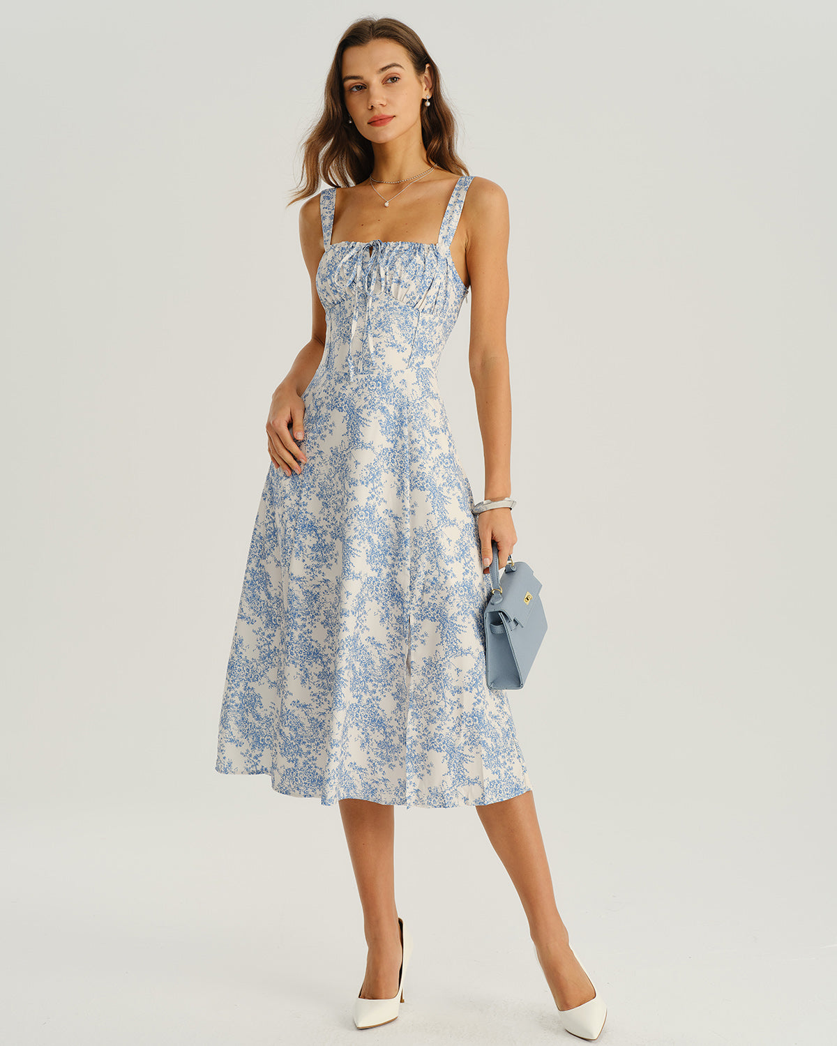 Luciana | Vestido midi azul con volantes y estampado floral